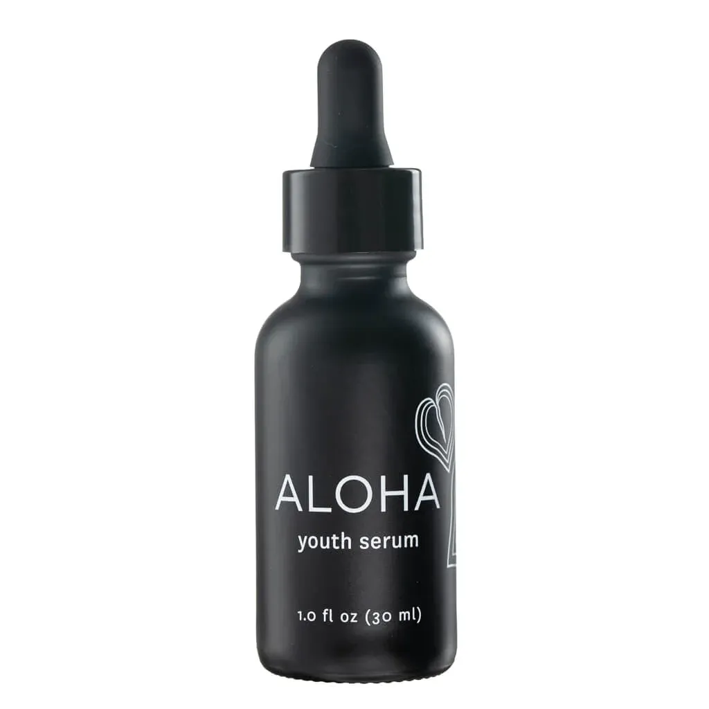 A black bottle of ALOHA youth serum against a light background, a potential contender for the best serum for dry skin.
