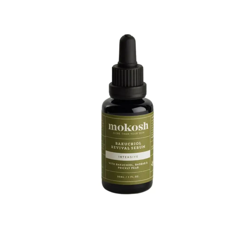 A dark amber bottle of mokosh BAKUCHIOL REVIVAL SERUM against a white background, a potential contender for the best Bakuchiol products for skincare
