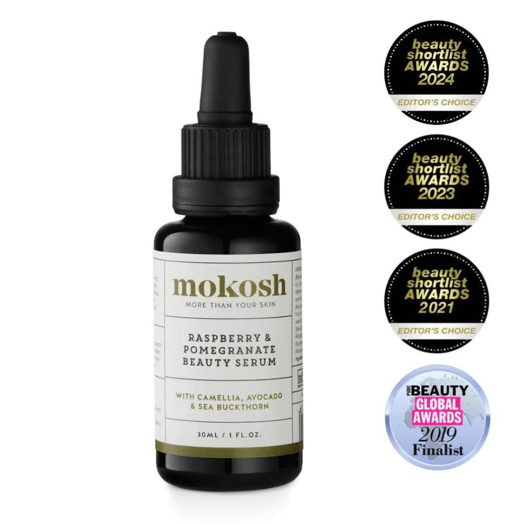 A dark bottle of mokosh RASPBERRY & POMEGRANATE BEAUTY SERUM against a light background, a potential contender for the best serum for dry skin
