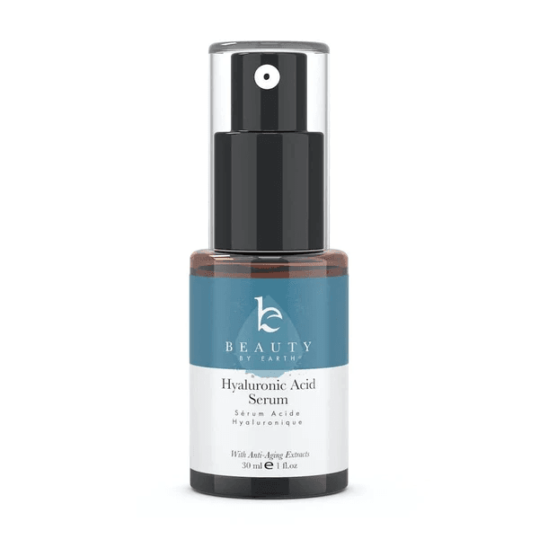 A dark brown bottle of BEAUTY BY EARTH Hyaluronic Acid Serum against a light background, a potential contender for the best serum for dry skin